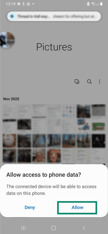 The camera gallery on an Android phone. There's a prompt asking for access to phone data, and the